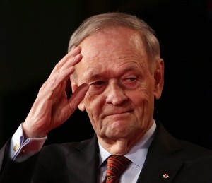 Former prime minister Jean Chretien saluts after addressing the Liberal Party leadership in Ottawa, Sunday April 14, 2013. Chretien is celebrated his 80th birthday Saturday. Chretien - who was PM for more than a decade between 1993 and 2003 - says he had a party with 80 family and friends Friday night in Montreal to mark the occasion. THE CANADIAN PRESS/Fred Chartrand 