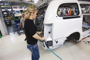 A worker on the production line at Chrysler's assembly plant in Windsor, Ontario, works on one of their new minivans on Tuesday, January 18, 2011.Chrysler is considering a billion dollar upgrade at its Ontario plant to build a new minivan, which is expected to go on sale in about two years.The Canadian Press/Geoff Robins 