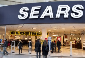 Shoppers make their way through the Sears store at the Eaton Centre in downtown Toronto on Monday, January 13, 2014. The store is having its final closing sale. THE CANADIAN PRESS/Frank Gunn 
