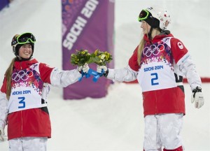 Canada's Justine Dufour-Lapointe (right) celebrates with her sister Chloe Dufour-Lapointe after winning the gold and silver medal respectively in the moguls at the Sochi Winter Olympics Saturday February 8, 2021 in Sochi, Russia. THE CANADIAN PRESS/Adrian Wyld 