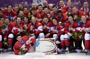 Team Canada celebrate with their gold medals after defeating Team Sweden to win the gold medal in Olympic final action at the Sochi Winter Olympics Sunday February 23, 2021 in Sochi, Russia. THE CANADIAN PRESS/Paul Chiasson 