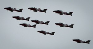 The Canadian Forces Snowbirds demonstration team fly over Comox, B.C., during a training flight on Thursday April 18, 2013. Canada's famed Snowbirds aerobatic flying team has been forced to cancel all shows in the United States because of budget cuts.THE CANADIAN PRESS/Darryl Dyck 