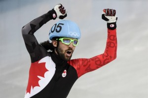 Canada's Charles Hamelin celebrates his gold medal victory in the men's 1500 metre short track speed skating final at the Sochi Winter Olympics Monday, February 10, 2021 in Sochi. THE CANADIAN PRESS/Paul Chiasson 