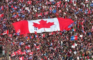 In this Friday, Oct. 27, 1995 file picture, a large Canadian flag is passed through a crowd in as thousands streamed into Montreal from all over Canada to join Quebecers rallying for national unity three days before a referendum that could propel Quebec toward secession. Even if Quebec voters had said “Oui” to independence in 1995, the United States wasn't going to say “Yes” to immediately recognizing the new country or including it in the North American Free Trade Agreement. THE CANADIAN PRESS/Ryan Remiorz