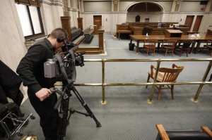 Jaison Empson, videographer for CBC, sets up his camera in the courtroom of the Court of Queens Bench Associate in preparation of Chief Justice Perlmutter pronouncing his decision on the second degree murder charge against Cassandra Knott in Winnipeg, Wednesday, April 16, 2014. Manitoba allowed a camera into its courts for the first time today. THE CANADIAN PRESS/John Woods
