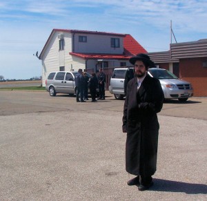 Nachman Helbrans stands in front of CBSA officials in Chatham on April 24, 2104. Photo Greg Holden