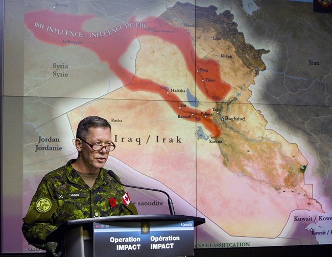 Canadian Lieutenant-General Jonathan Vance, Commander of Canadian Joint Operation Command, holds a technical briefing on combat strikes against the Islamic State of Irag (ISIL) in Ottawa, at National Defence Heaquarters, Tuesday November 4, 2014. THE CANADIAN PRESS/Fred Chartrand 