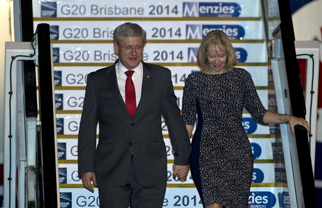 Canadian Prime Minister Stephen Harper and his wife Laureen arrive in Brisbane, Australia for the G20 Summit Friday, November 14, 2014. THE CANADIAN PRESS/Adrian Wyld 