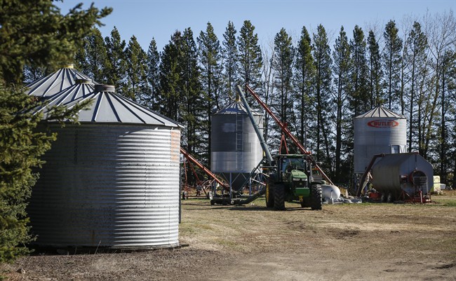 Grain bins and farm machinery at the scene where three girls died in a tragic farm accident near Withrow, Alta., Wednesday, Oct. 14, 2015.THE CANADIAN PRESS/Jeff McIntosh 