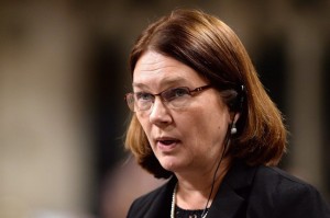 Health Minister Jane Philpott rises during question period in the House of Commons on Parliament Hill in Ottawa on Dec. 8, 2015. The escalating debate over doctor-assisted death could be the perfect chance for Canada to fix its broken system of palliative care -- a "dark secret" that health advocates say has been quietly deteriorating in the shadows for decades. THE CANADIAN PRESS/Sean Kilpatrick